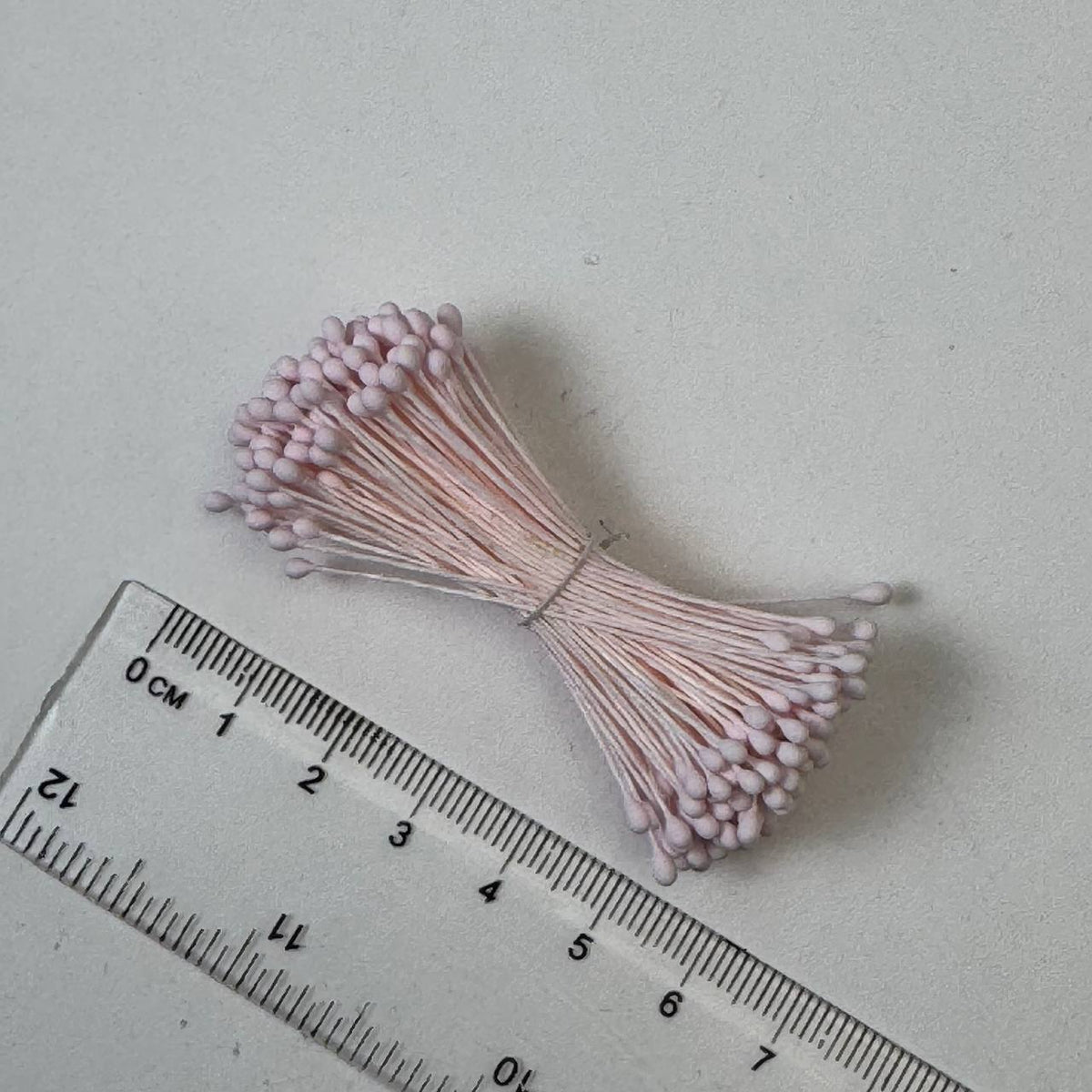 Light pink naturalistic flower stamens size L with botanical shapes on matching light pink cotton threads, bundle of 144 pieces, premium Japanese floral supplies