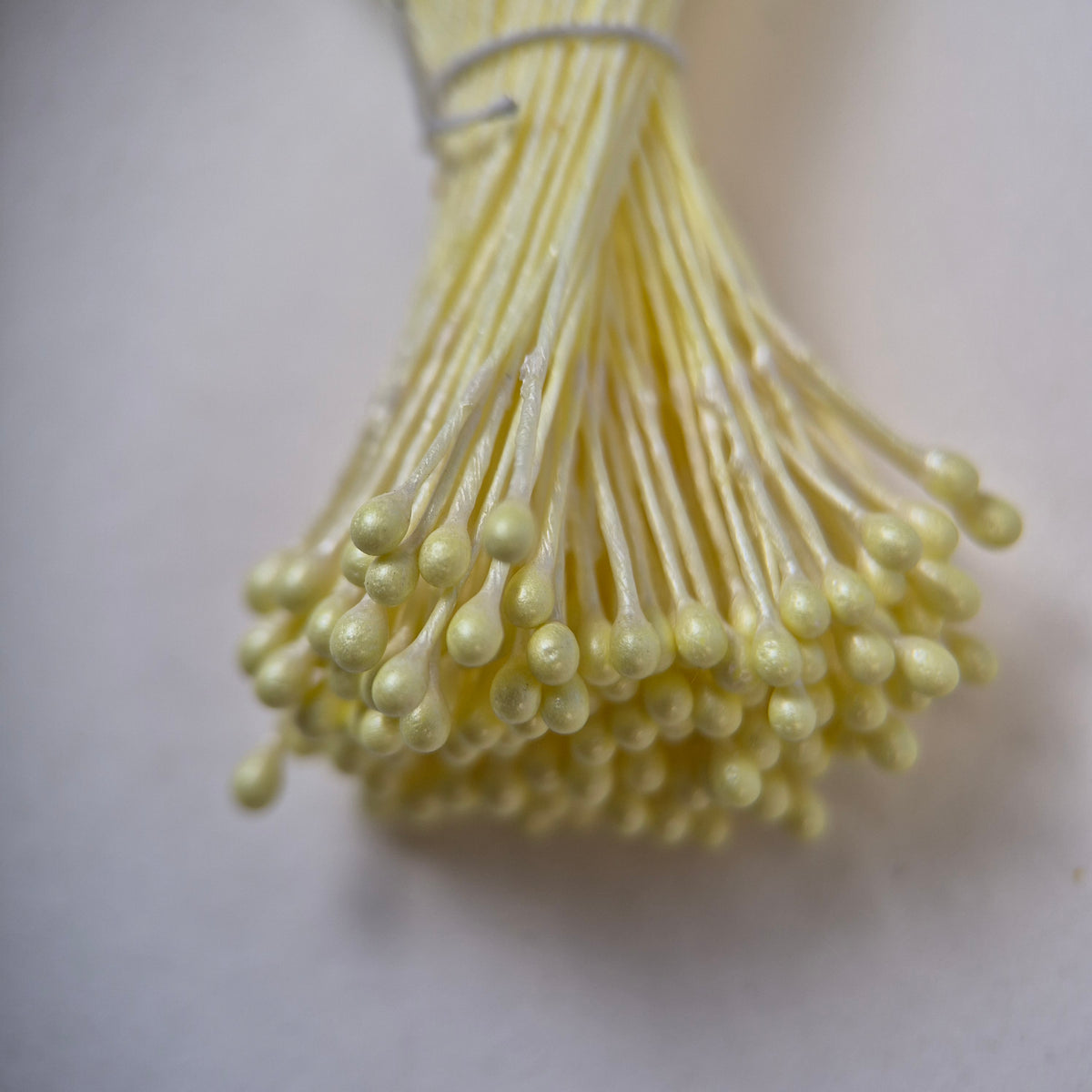 Yellow pearly round ball flower stamens size M with glossy luster on matching yellow cotton threads, premium Japanese craft supplies