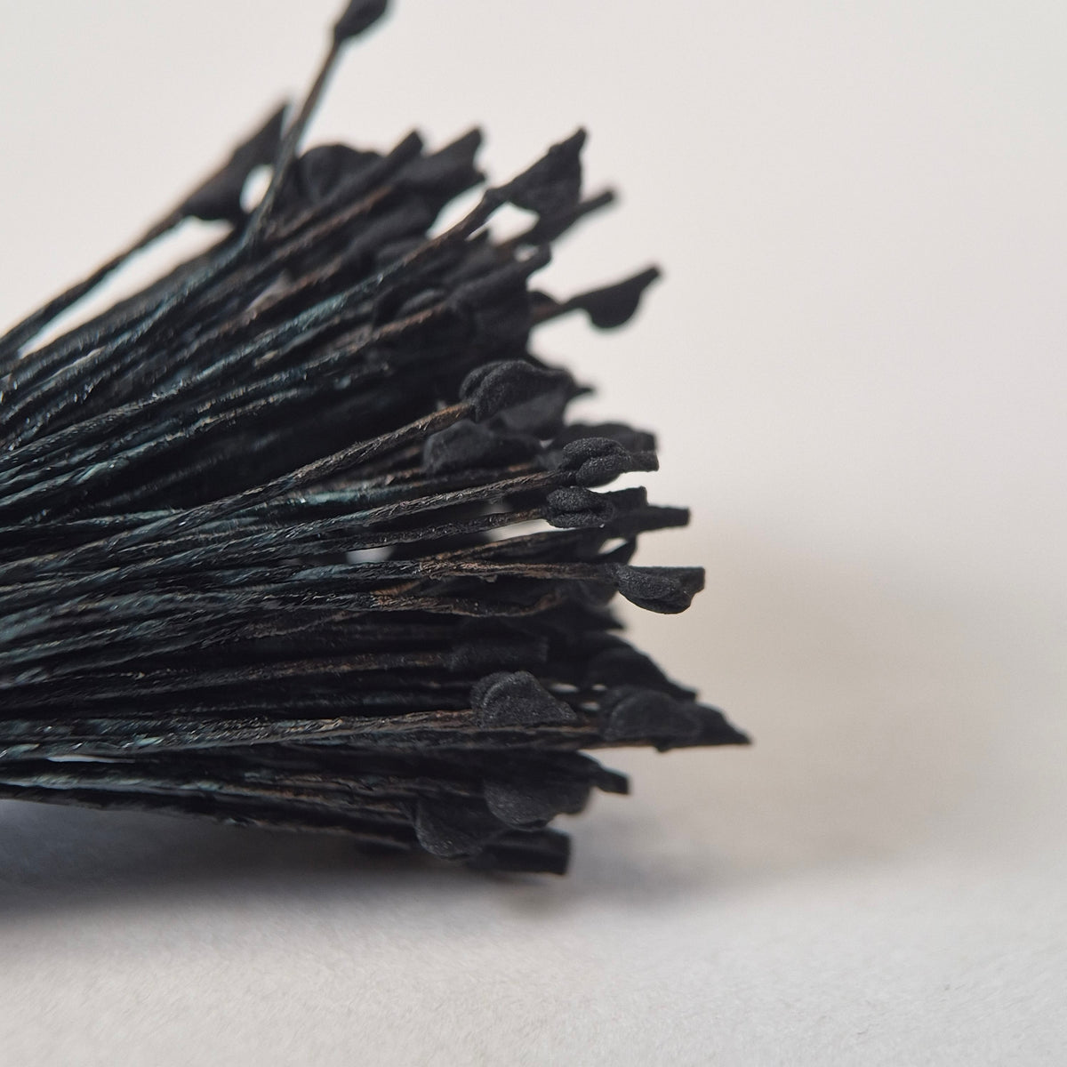 Miniature black naturalistic flower stamens size S with botanical shapes on black cotton threads, premium Japanese craft supplies