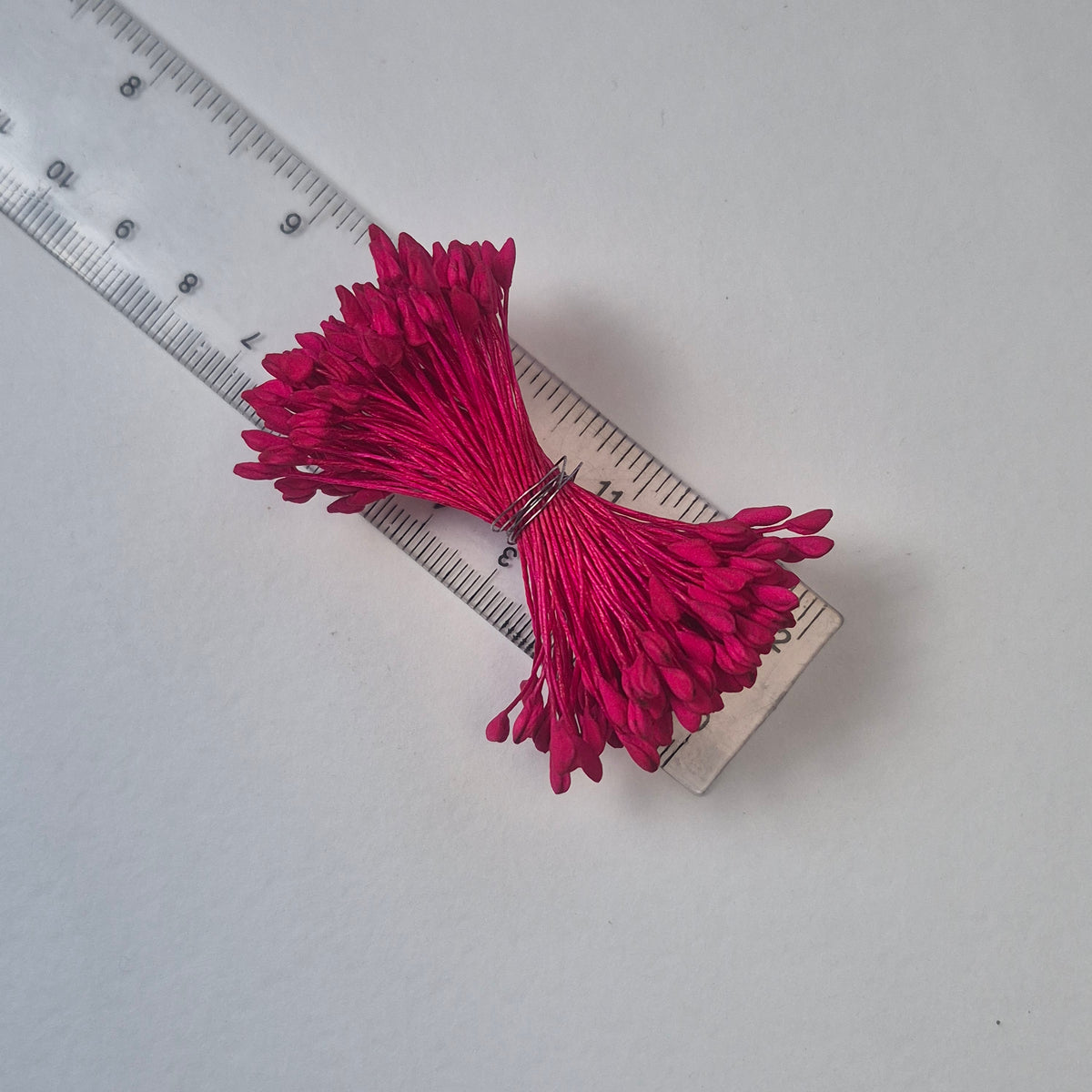 A bundle of extra-large size XL naturalistic Japanese flower stamens, featuring vibrant bright pink droplet-shaped heads on matching pink rayon threads