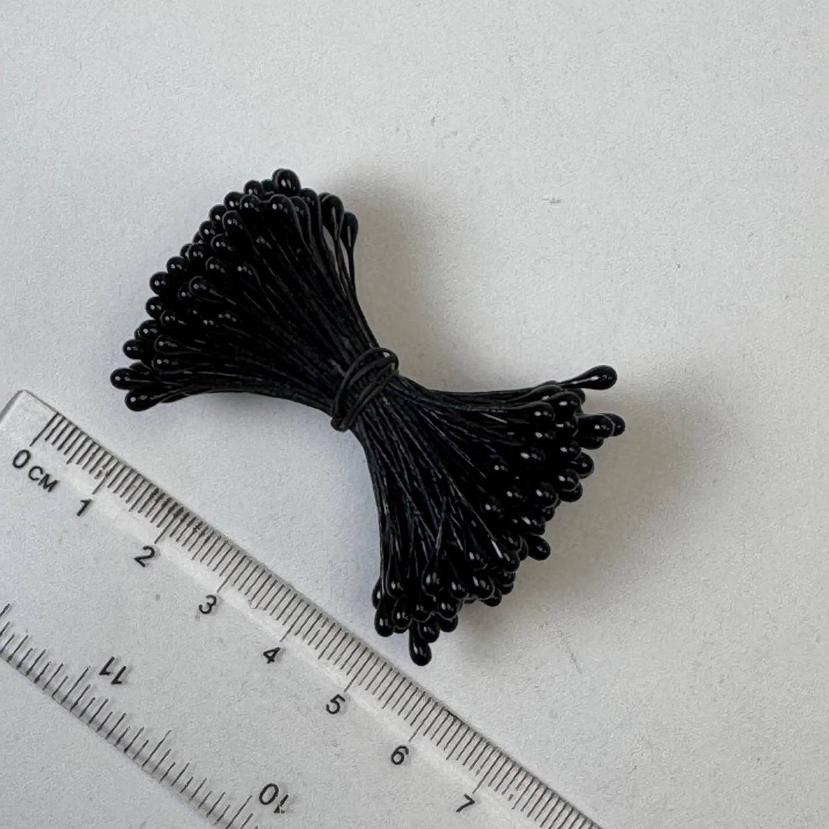 Black pearl flower stamens size L with glossy finish on matching black cotton threads, bundle of 144 pieces, premium Japanese floral supplies