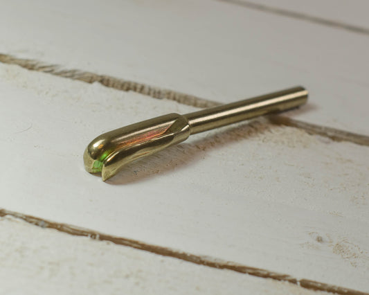Petal Iron Tip on a light wooden surface