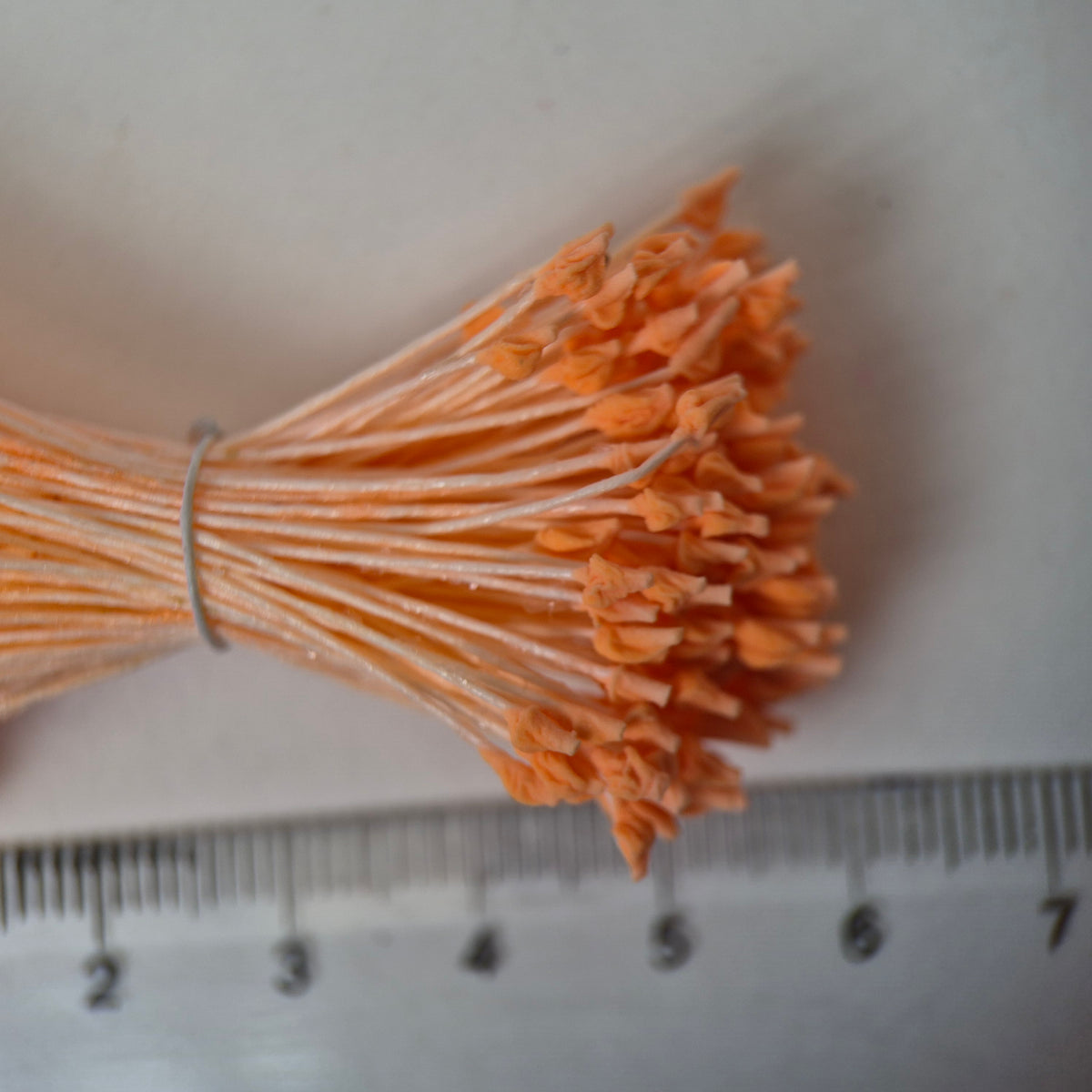 Orange naturalistic flower stamens size L with botanical shapes on orange cotton threads, premium Japanese craft supplies