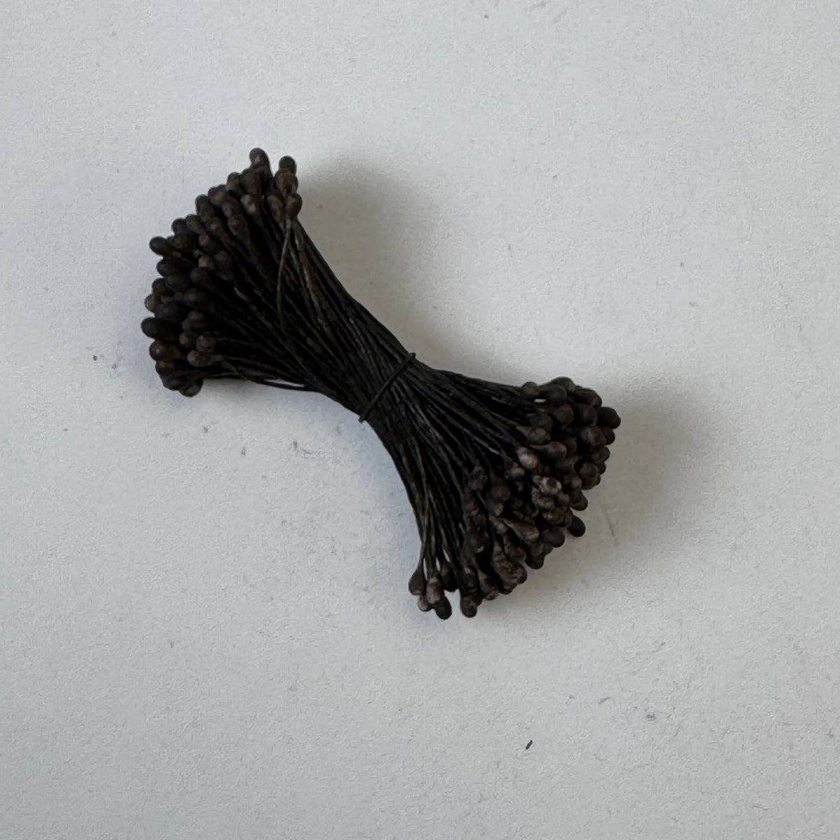 Two-tone dark brown and cream naturalistic flower stamens size L with botanical shapes on dark brown cotton threads, bundle of 144 pieces, premium Japanese floral supplies