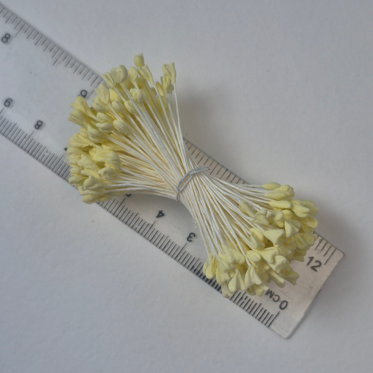 A bundle of extra-large size XL naturalistic Japanese flower stamens, featuring vibrant lemon droplet-shaped heads on contrasting cream rayon threads