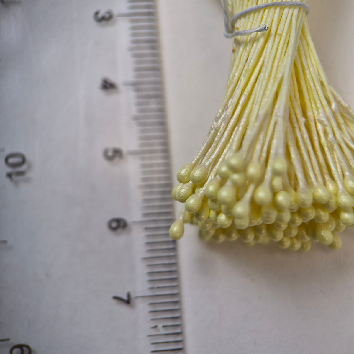 Yellow pearly round ball flower stamens size M with glossy luster on matching yellow cotton threads, premium Japanese craft supplies