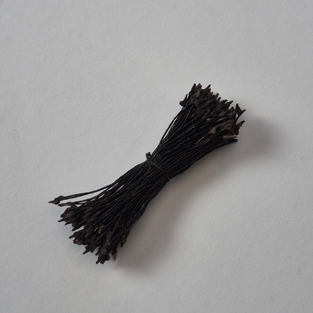 Miniature black naturalistic flower stamens size S with botanical shapes on black cotton threads, premium Japanese craft supplies