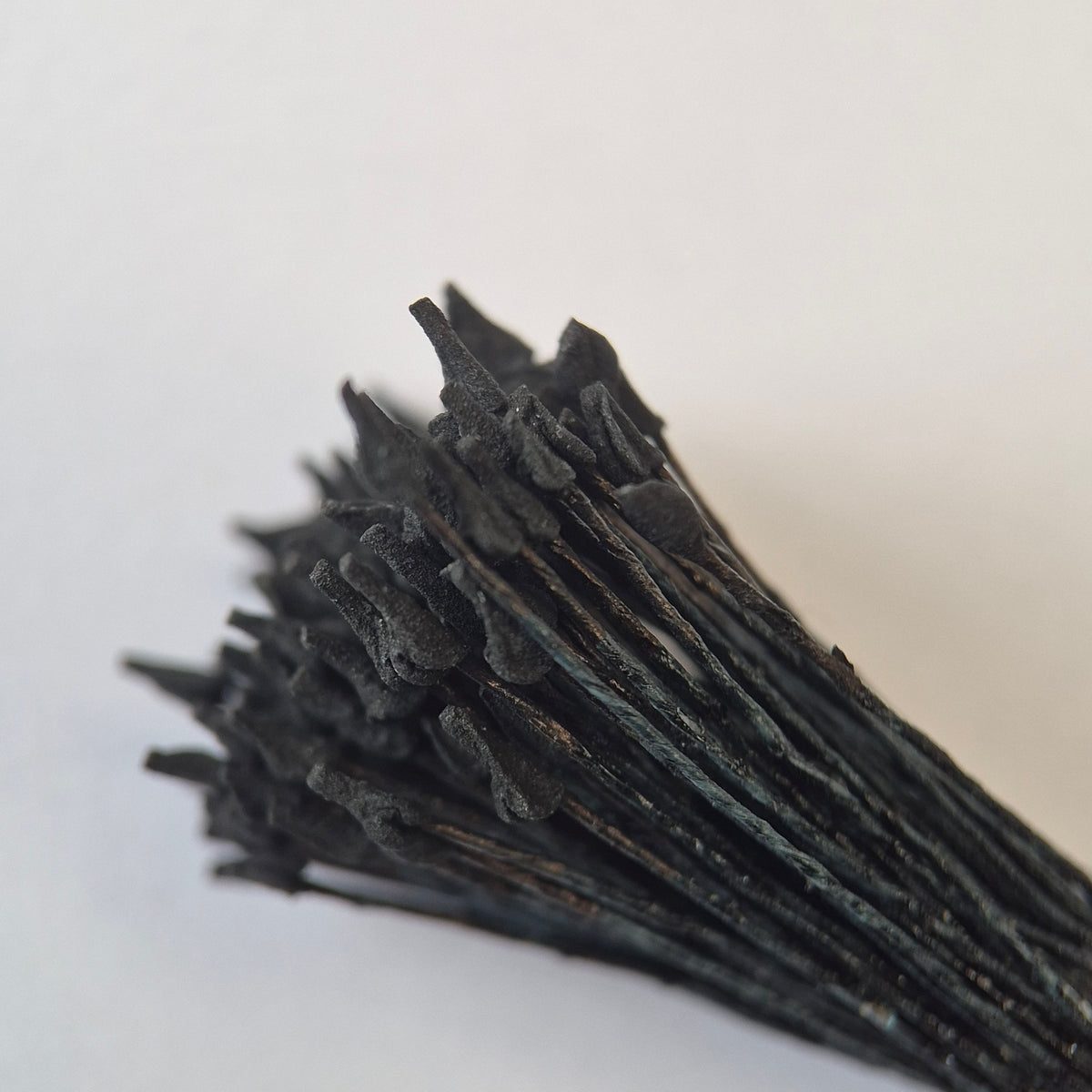 Miniature black naturalistic flower stamens size S with botanical shapes on black cotton threads, premium Japanese craft supplies