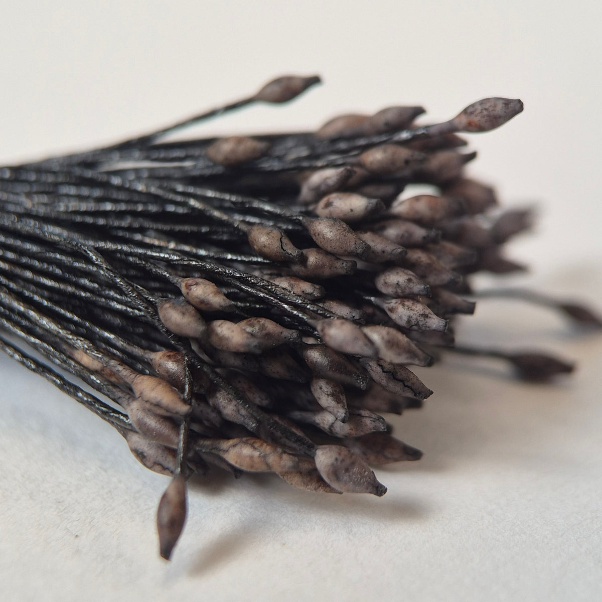 Miniature brown elongated flower stamens size S on matching brown cotton threads, premium Japanese floral supplies