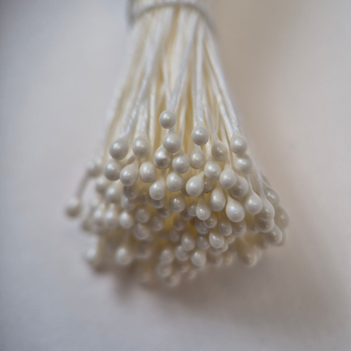 Cream pearly round ball flower stamens size M with glossy luster on matching cream cotton threads, premium Japanese craft supplies