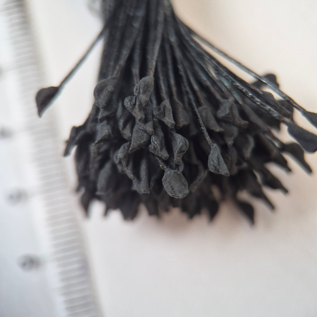 Dark brown naturalistic flower stamens size L with botanical shapes on matching cotton threads, premium Japanese craft supplies