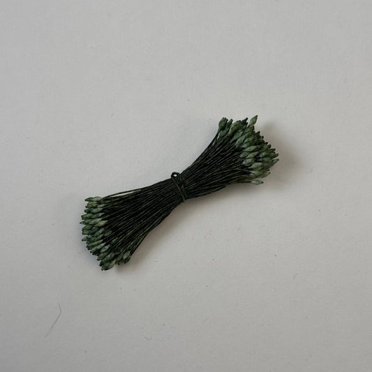 Miniature green elongated flower stamens size S on matching green cotton threads, premium Japanese floral supplies