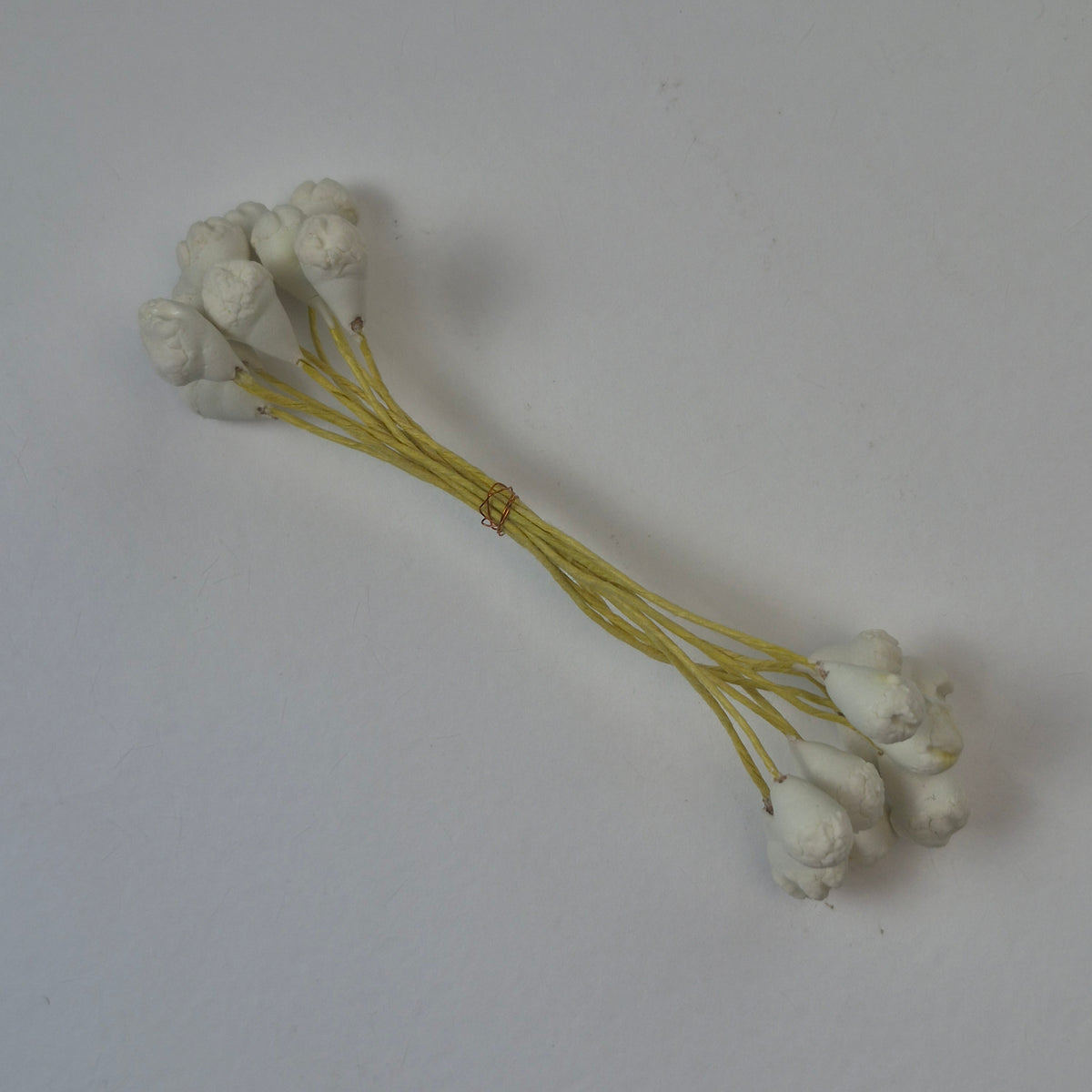 A bundle of 10 flexible yellow wire stems with 20 white closed decorative Japanese flower buds