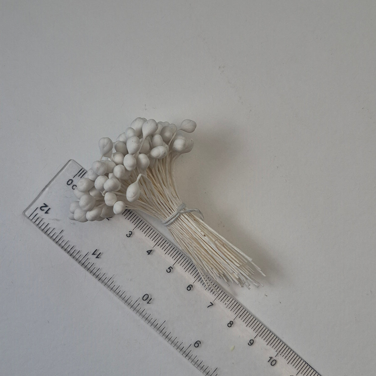 A bundle of 144 single-sided white decorative Japanese flower stamens/buds on high-quality white threads, featuring smooth droplet-shaped heads