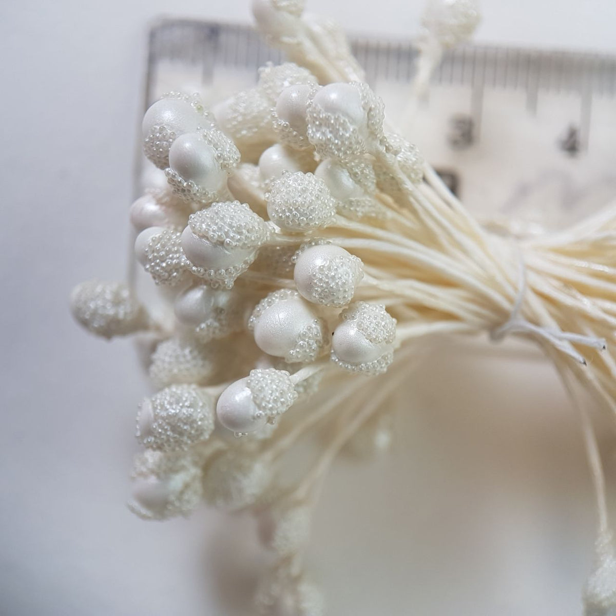 A bundle of extra-large size XL textured Japanese flower stamens, featuring elegant pearl droplet-shaped heads decorated with shimmering white microbeads