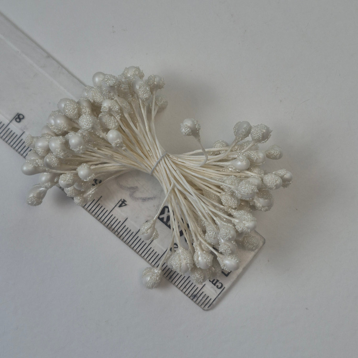 A bundle of extra-large size XL textured Japanese flower stamens, featuring elegant pearl droplet-shaped heads decorated with shimmering white microbeads