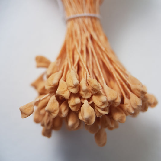 A bundle of extra-large size XL naturalistic Japanese flower stamens, featuring soft beige droplet-shaped heads on matching beige rayon threads