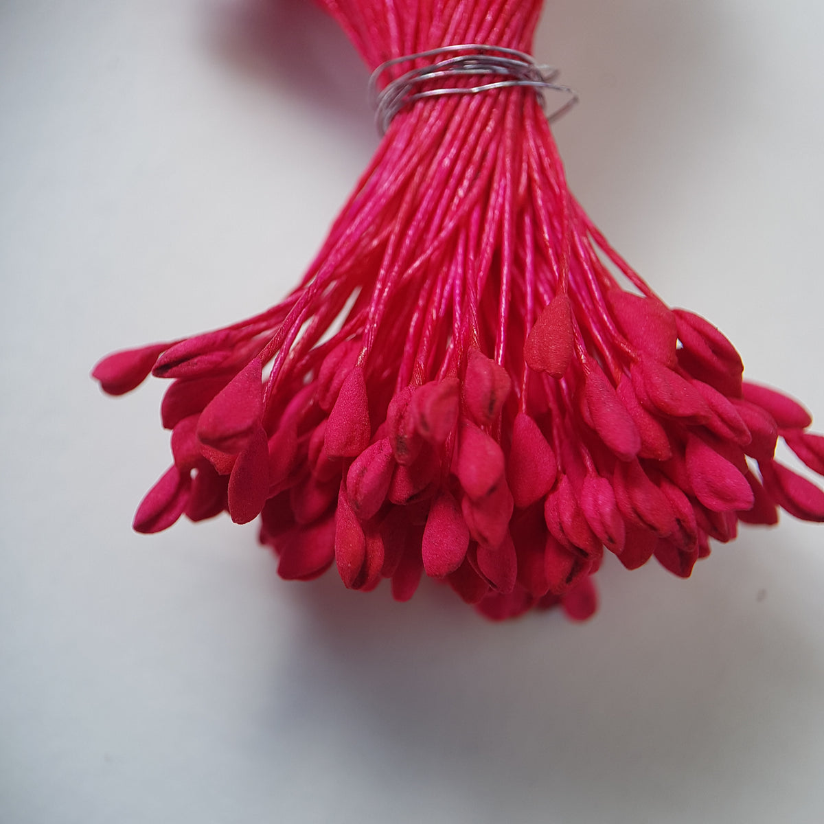 A bundle of extra-large size XL naturalistic Japanese flower stamens, featuring vibrant bright pink droplet-shaped heads on matching pink rayon threads