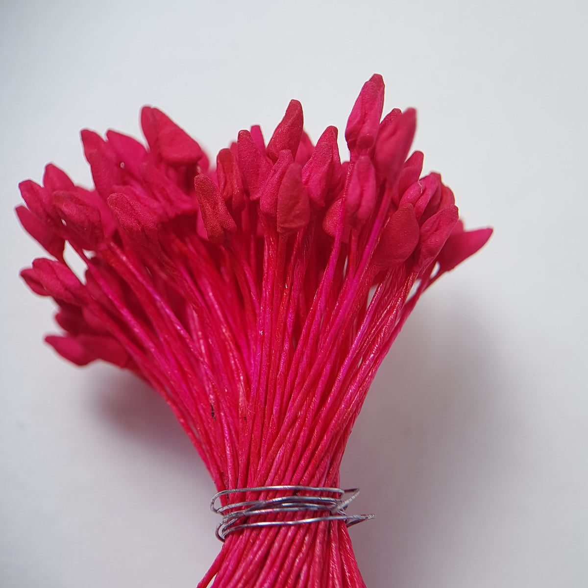 A bundle of extra-large size XL naturalistic Japanese flower stamens, featuring vibrant bright pink droplet-shaped heads on matching pink rayon threads