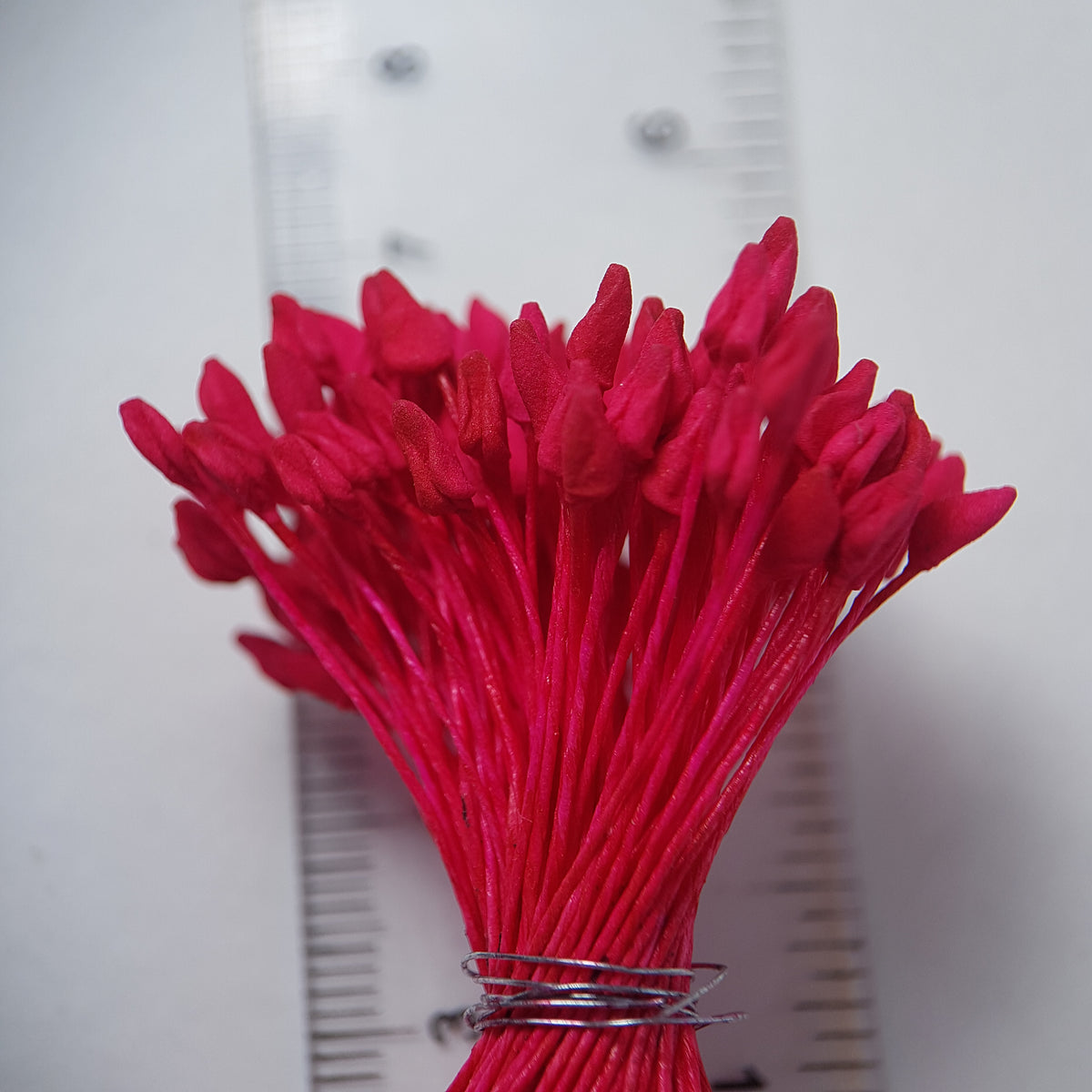 A bundle of extra-large size XL naturalistic Japanese flower stamens, featuring vibrant bright pink droplet-shaped heads on matching pink rayon threads