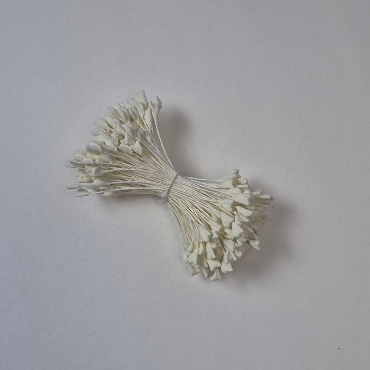 A bundle of extra-large size XL naturalistic Japanese flower stamens, featuring elegant cream droplet-shaped heads on matching cream rayon threads