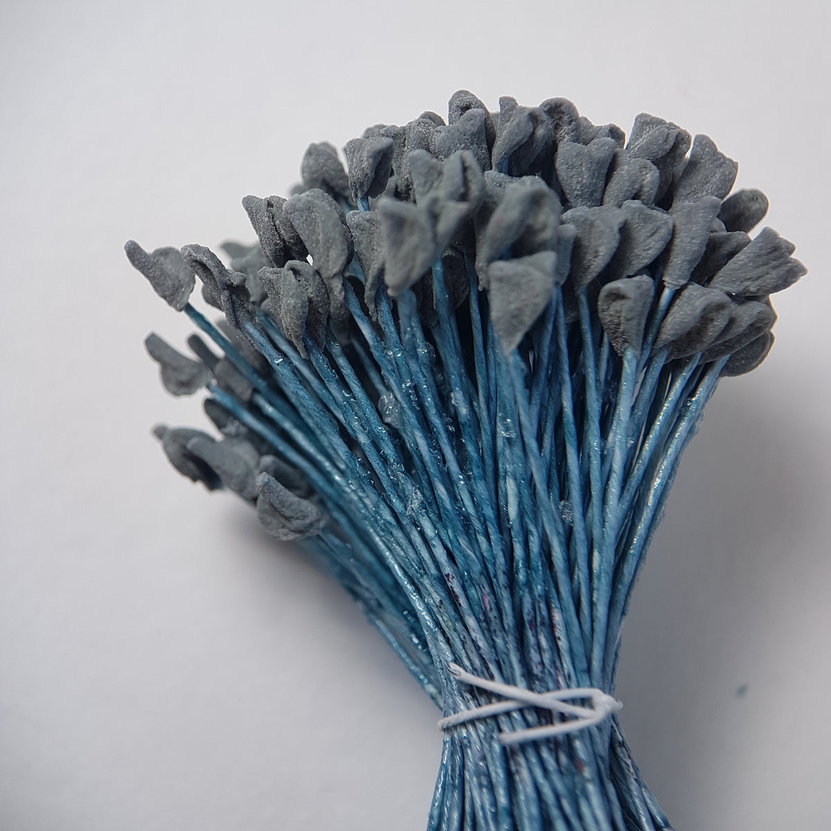 A bundle of extra-large size XL naturalistic Japanese flower stamens, featuring subtle grey droplet-shaped heads on contrasting light blue rayon threads
