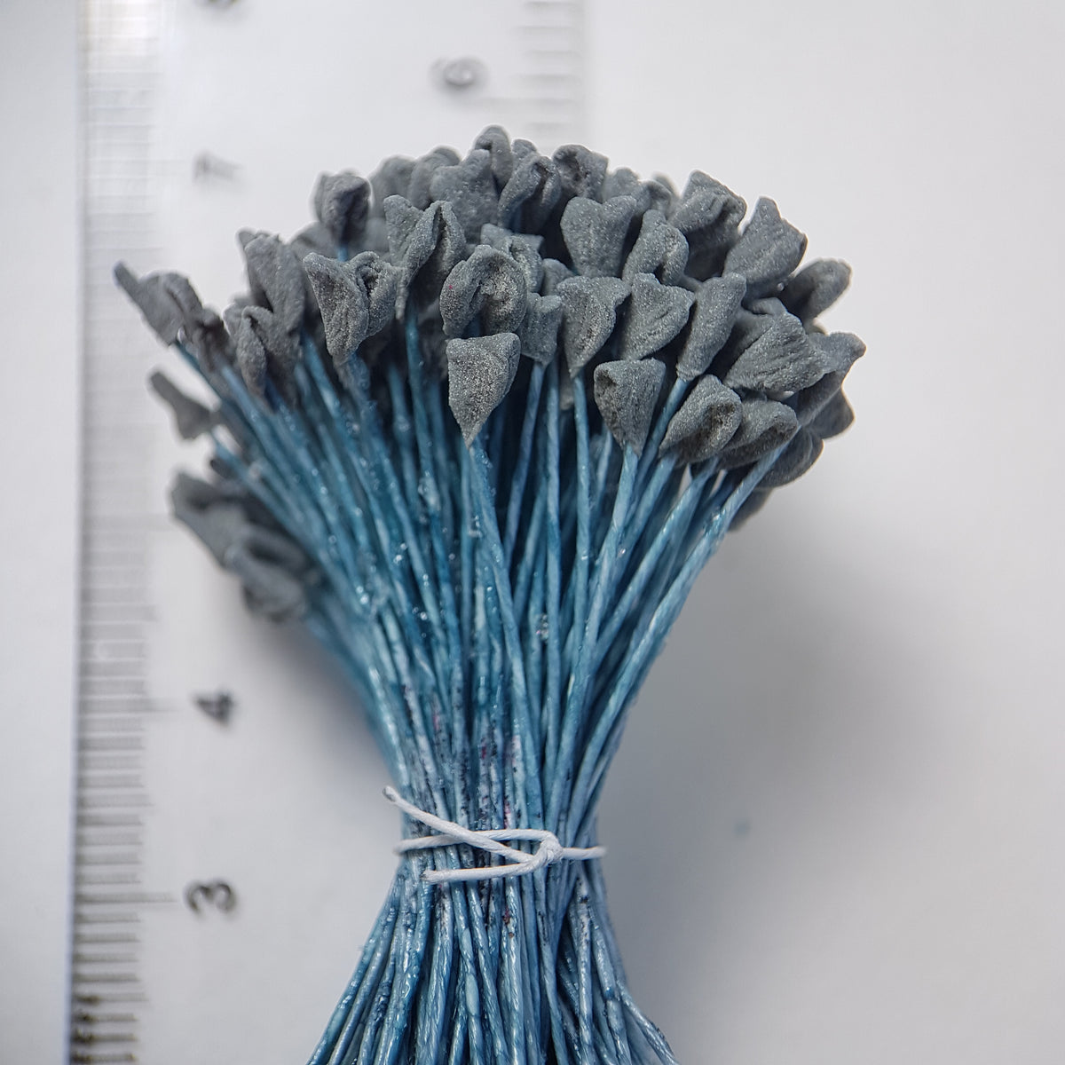 A bundle of extra-large size XL naturalistic Japanese flower stamens, featuring subtle grey droplet-shaped heads on contrasting light blue rayon threads
