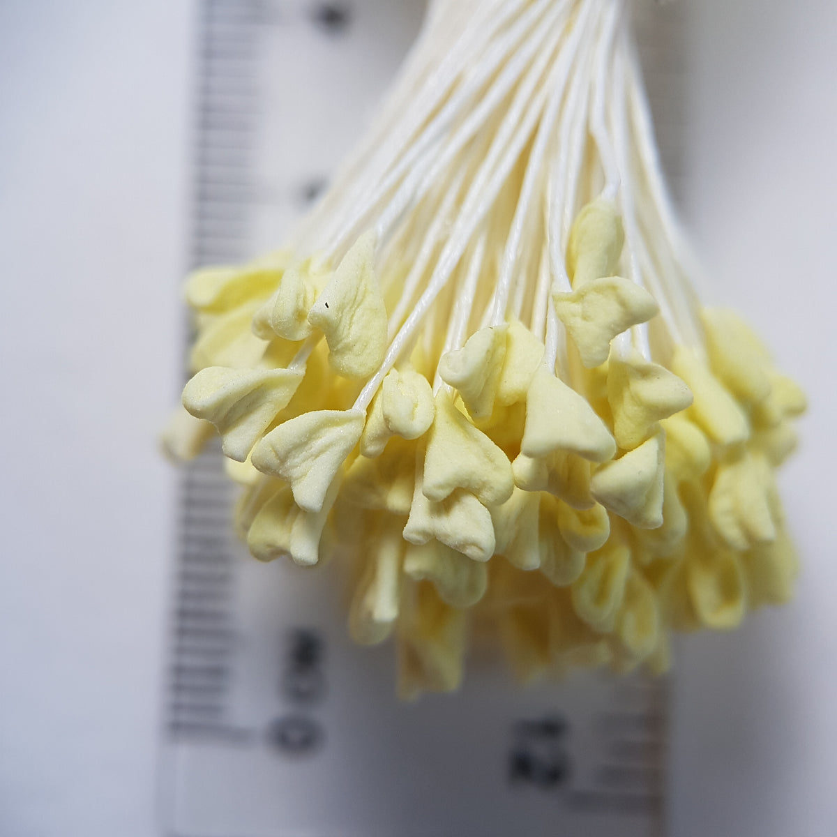 A bundle of extra-large size XL naturalistic Japanese flower stamens, featuring vibrant lemon droplet-shaped heads on contrasting cream rayon threads