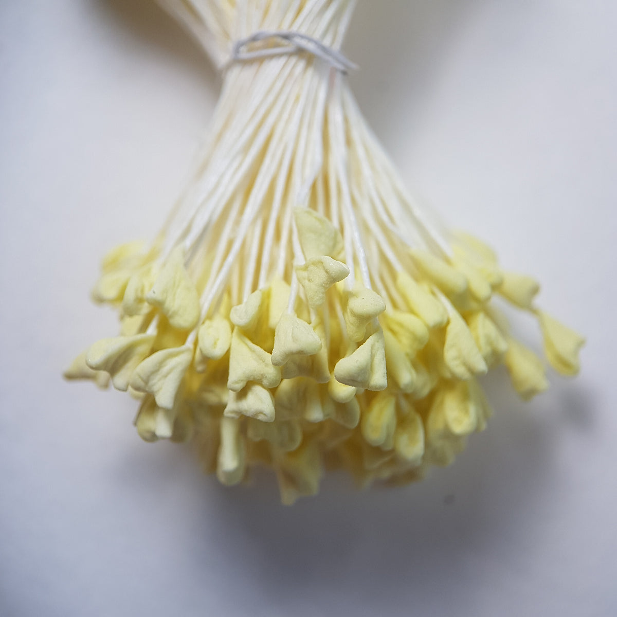A bundle of extra-large size XL naturalistic Japanese flower stamens, featuring vibrant lemon droplet-shaped heads on contrasting cream rayon threads