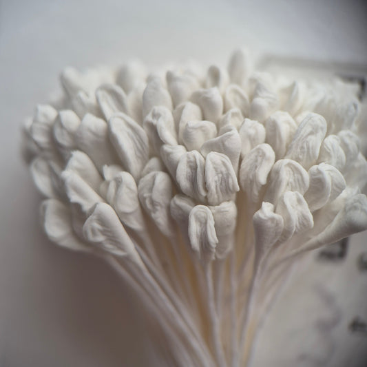 A bundle of 144 single-sided extra-large size XL white decorative Japanese flower stamens for lilies and tulips on matching white threads, featuring large handmade elongated heads measured against a ruler