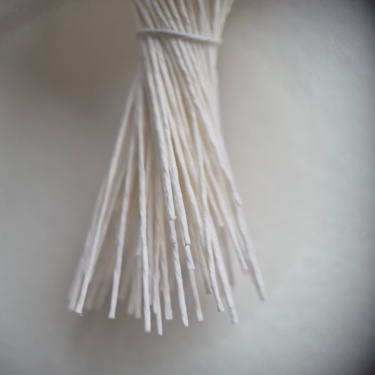 A bundle of 144 single-sided extra-large size XL white decorative Japanese flower stamens for lilies and tulips on matching white threads, featuring large handmade elongated heads measured against a ruler