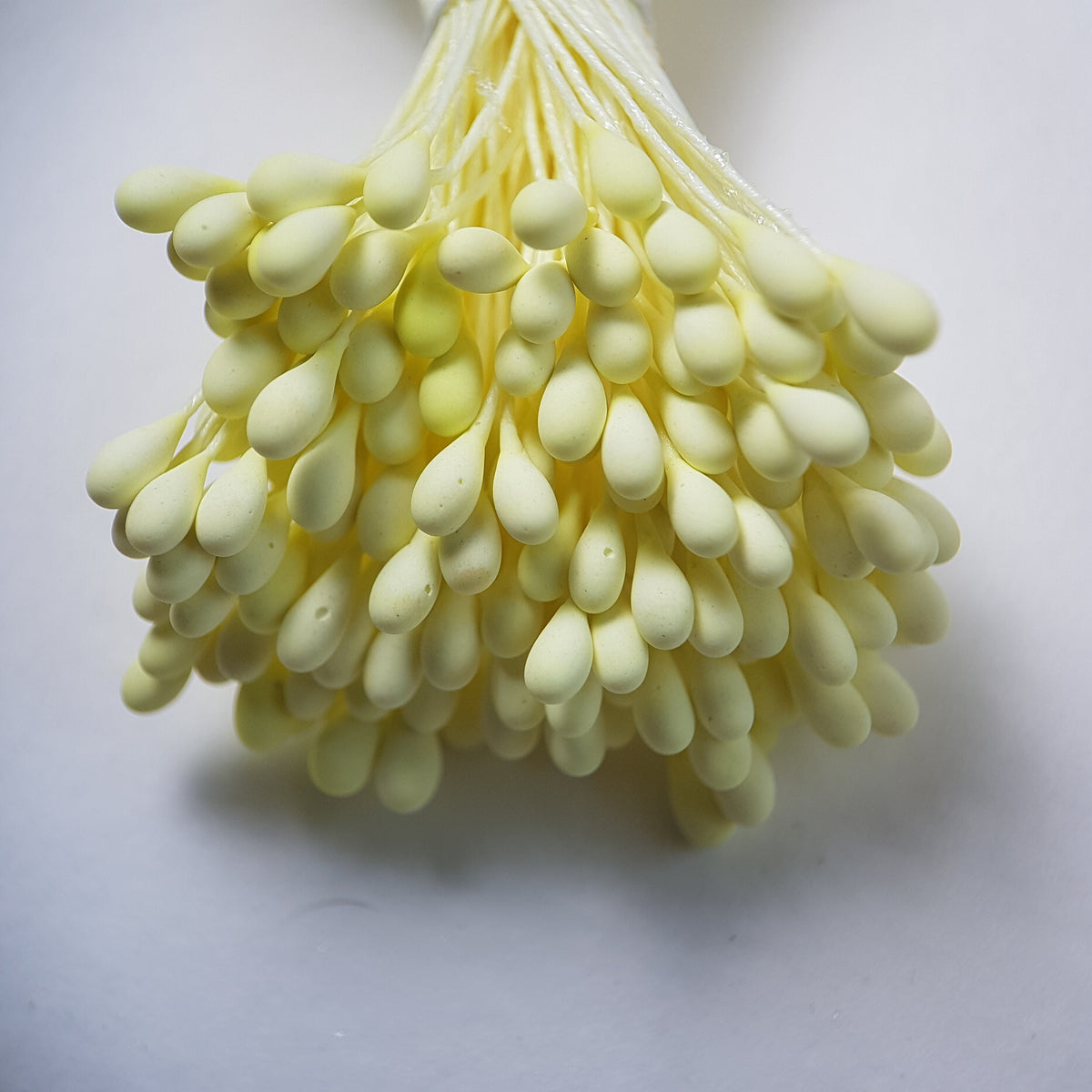 A bundle of size L Japanese flower stamens, featuring vibrant lemon round heads on matching lemon cotton threads