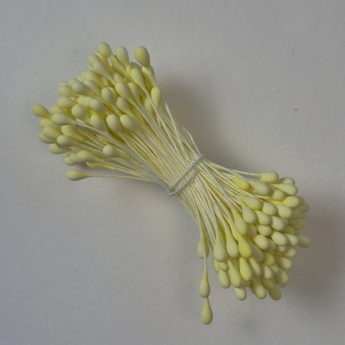 A bundle of size L Japanese flower stamens, featuring vibrant lemon round heads on matching lemon cotton threads