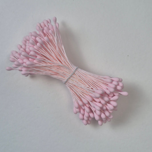 A bundle of size L Japanese flower stamens, featuring vibrant pink droplet-shaped heads on matching pink cotton threads