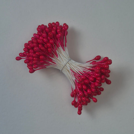 A bundle of size L Japanese flower stamens, featuring vibrant red round heads on white cotton threads.