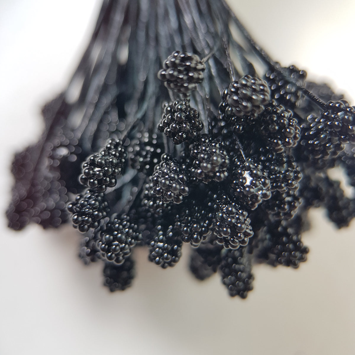 A bundle of extra-large size XL Japanese flower stamens made of rice flour and black rayon threads, featuring deep black textured gypsophila-shaped cluster heads