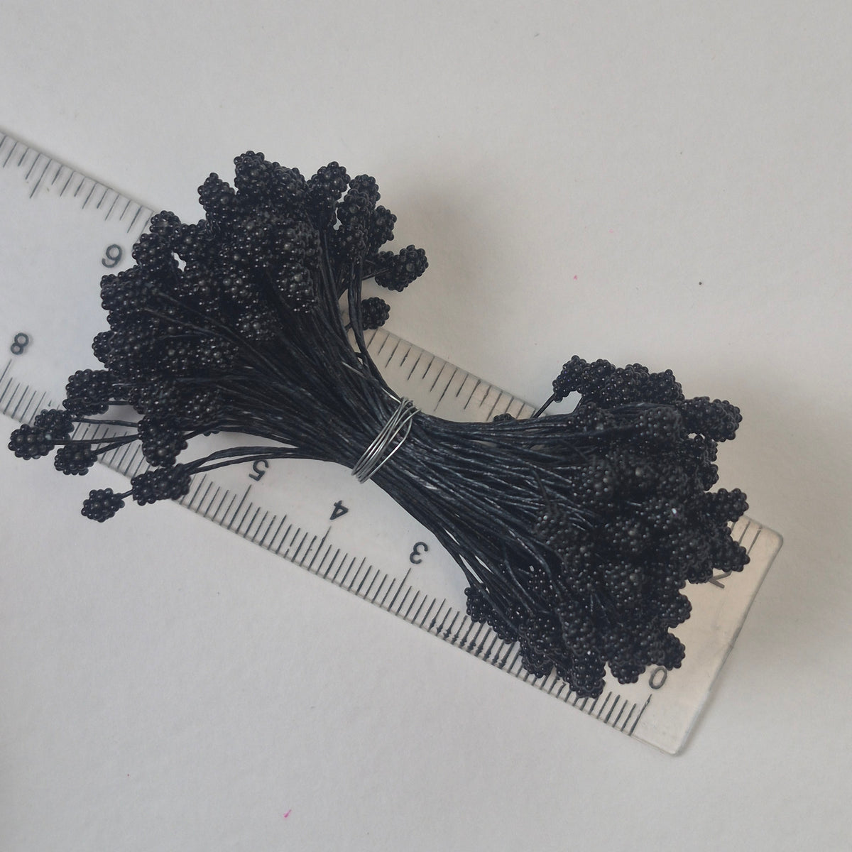 A bundle of extra-large size XL Japanese flower stamens made of rice flour and black rayon threads, featuring deep black textured gypsophila-shaped cluster heads