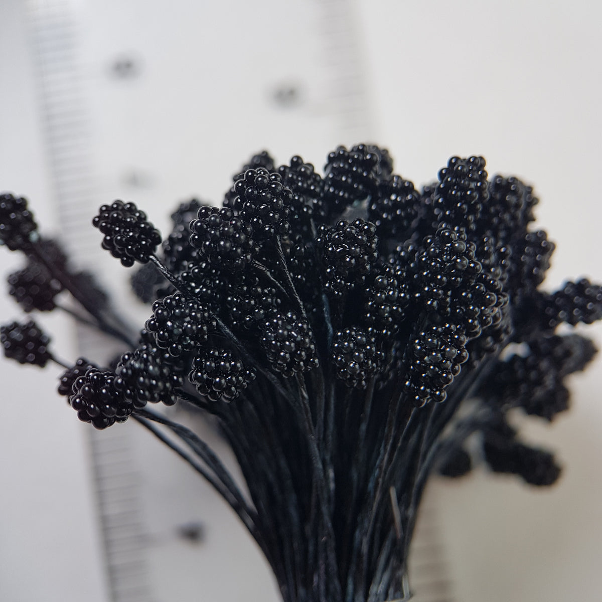 A bundle of extra-large size XL Japanese flower stamens made of rice flour and black rayon threads, featuring deep black textured gypsophila-shaped cluster heads