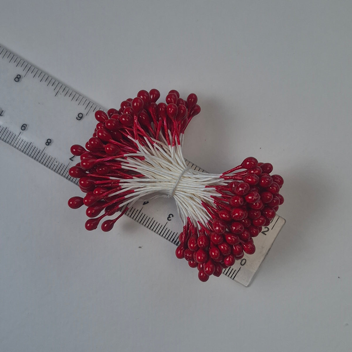 A bundle of extra-large size XL Japanese flower stamens made of rice flour and white rayon threads, featuring vibrant red round heads