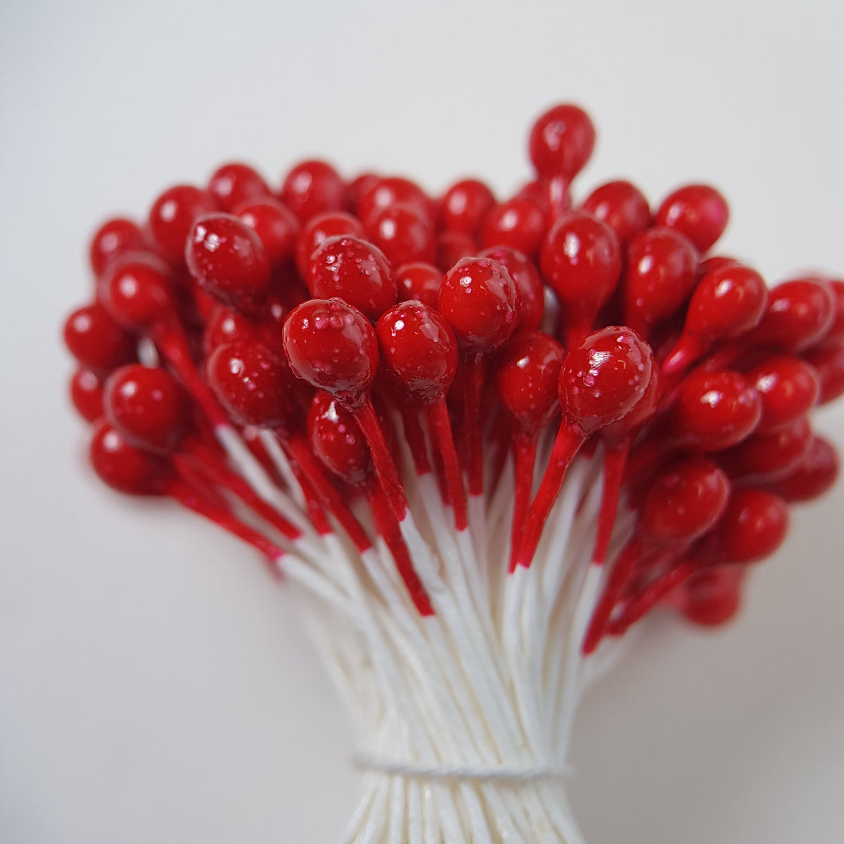 A bundle of extra-large size XL Japanese flower stamens made of rice flour and white rayon threads, featuring vibrant red round heads