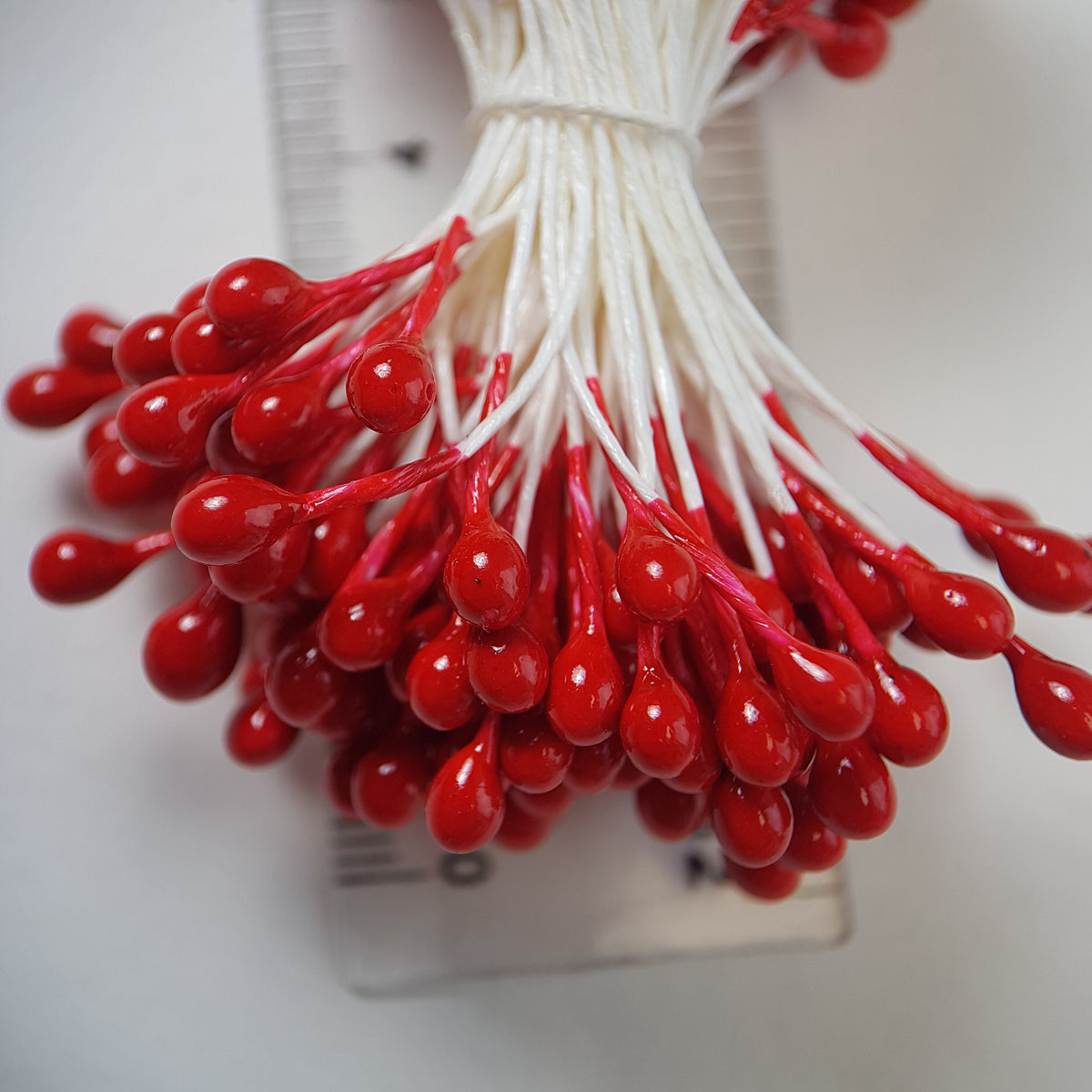 A bundle of extra-large size XL Japanese flower stamens made of rice flour and white rayon threads, featuring vibrant red round heads