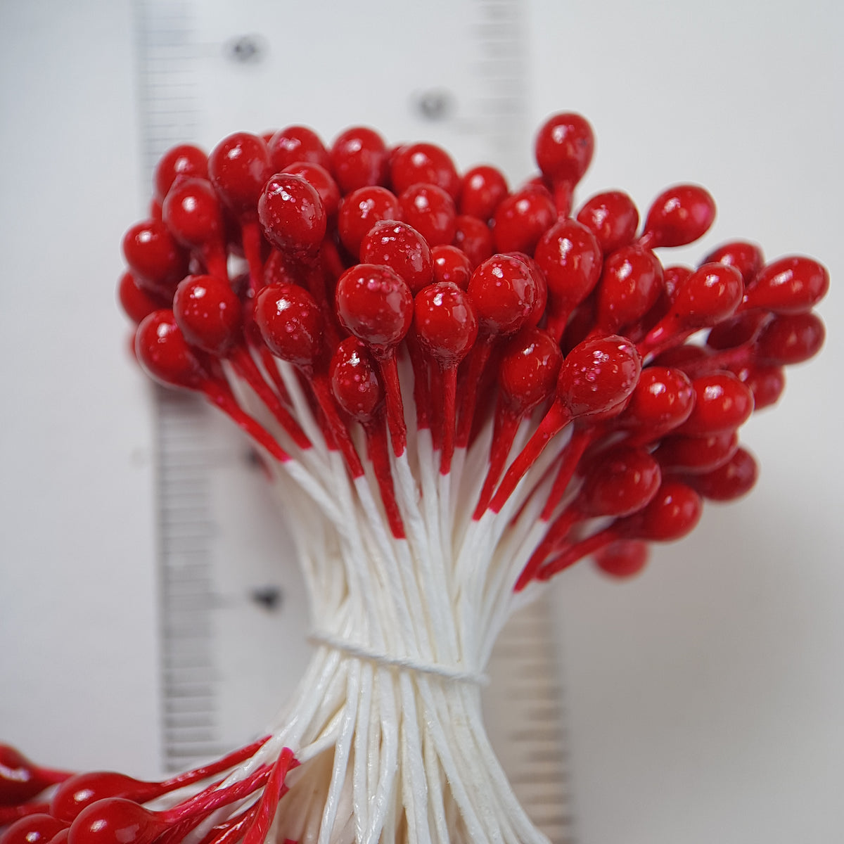 A bundle of extra-large size XL Japanese flower stamens made of rice flour and white rayon threads, featuring vibrant red round heads