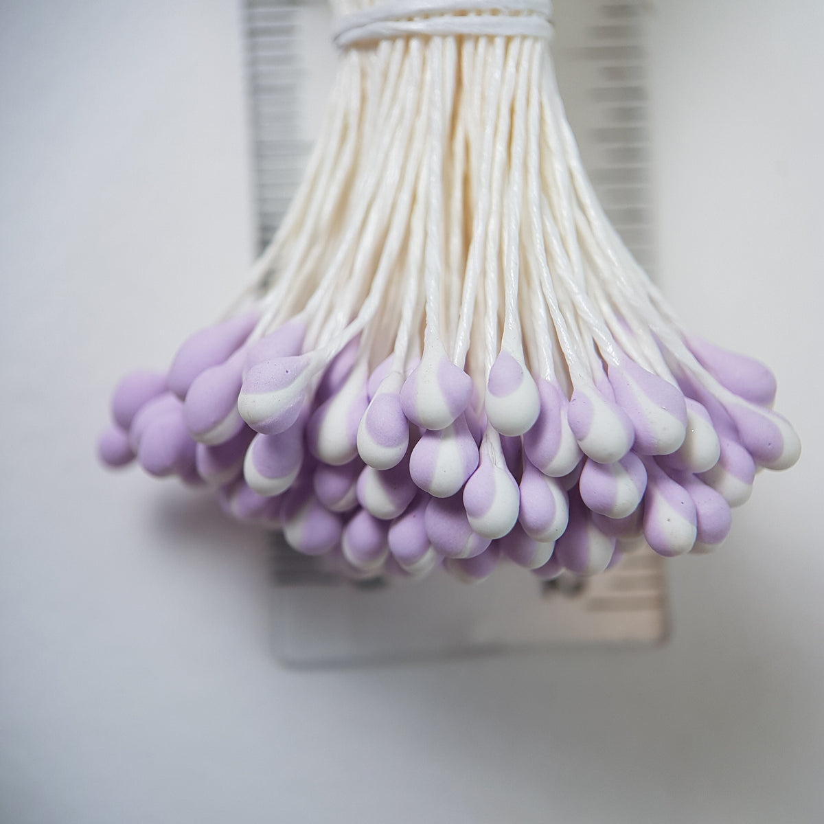 A bundle of extra-large size XL Japanese flower stamens made of rice flour and white rayon threads, featuring unique two-tone lilac and white droplet-shaped heads