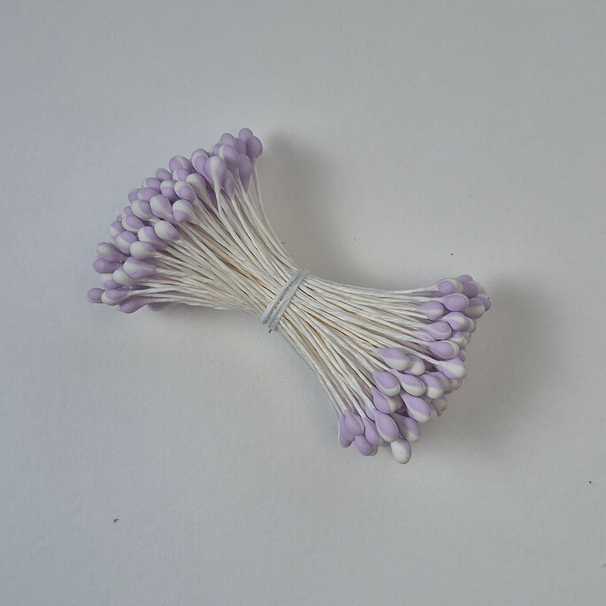 A bundle of extra-large size XL Japanese flower stamens made of rice flour and white rayon threads, featuring unique two-tone lilac and white droplet-shaped heads