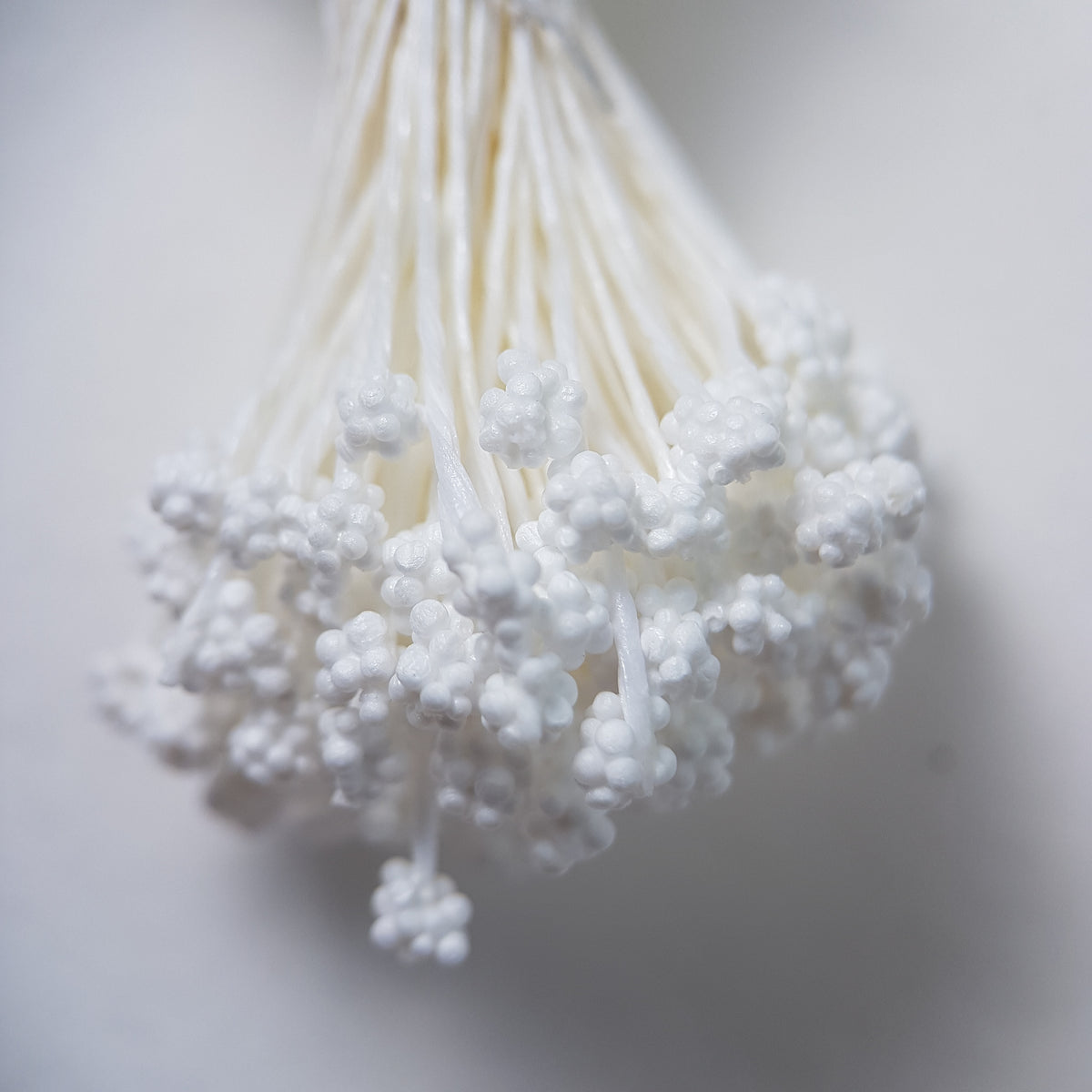 A bundle of extra-large size XL Japanese flower stamens made of rice flour and white rayon threads, featuring pure white textured gypsophila-shaped cluster heads next to a ruler