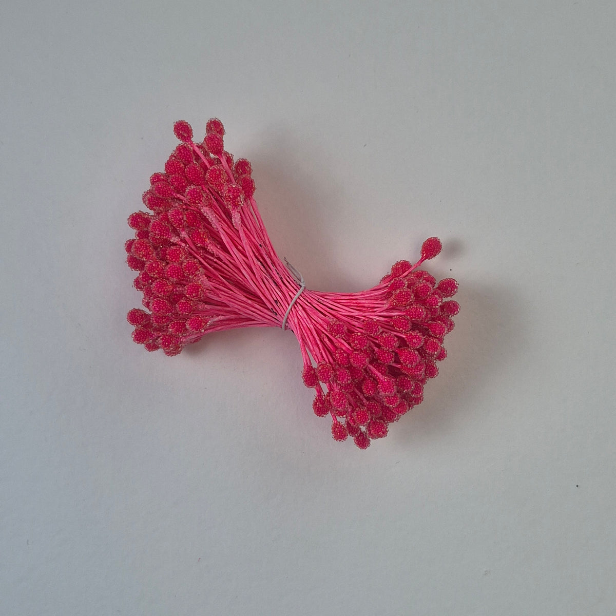 A bundle of size XL Japanese bright pink sugar ball flower stamens made of rice flour and matching pink rayon threads, featuring 5mm frosted textured round heads next to a ruler