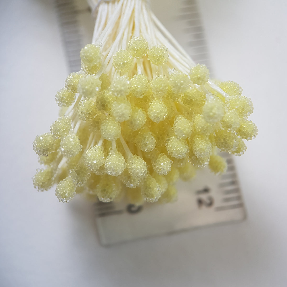 A bundle of size XL Japanese lemon sugar ball flower stamens made of rice flour and cream rayon threads, featuring 5mm frosted round heads