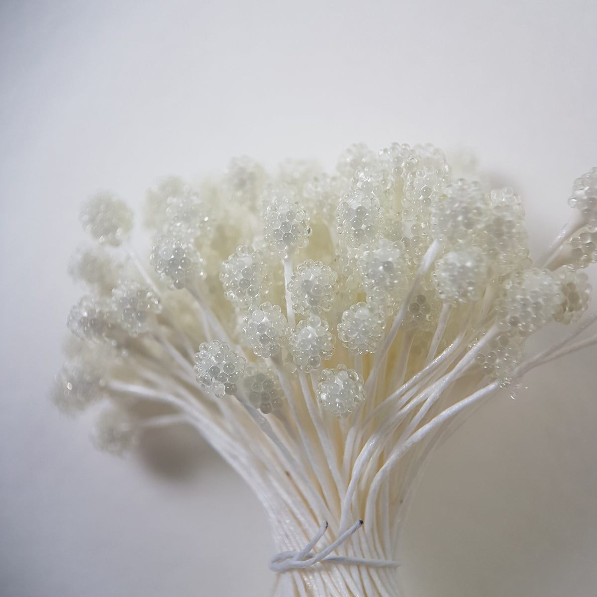 A bundle of size XL Japanese white sugar ball flower stamens made of rice flour and white rayon threads, featuring 5mm frosted round heads