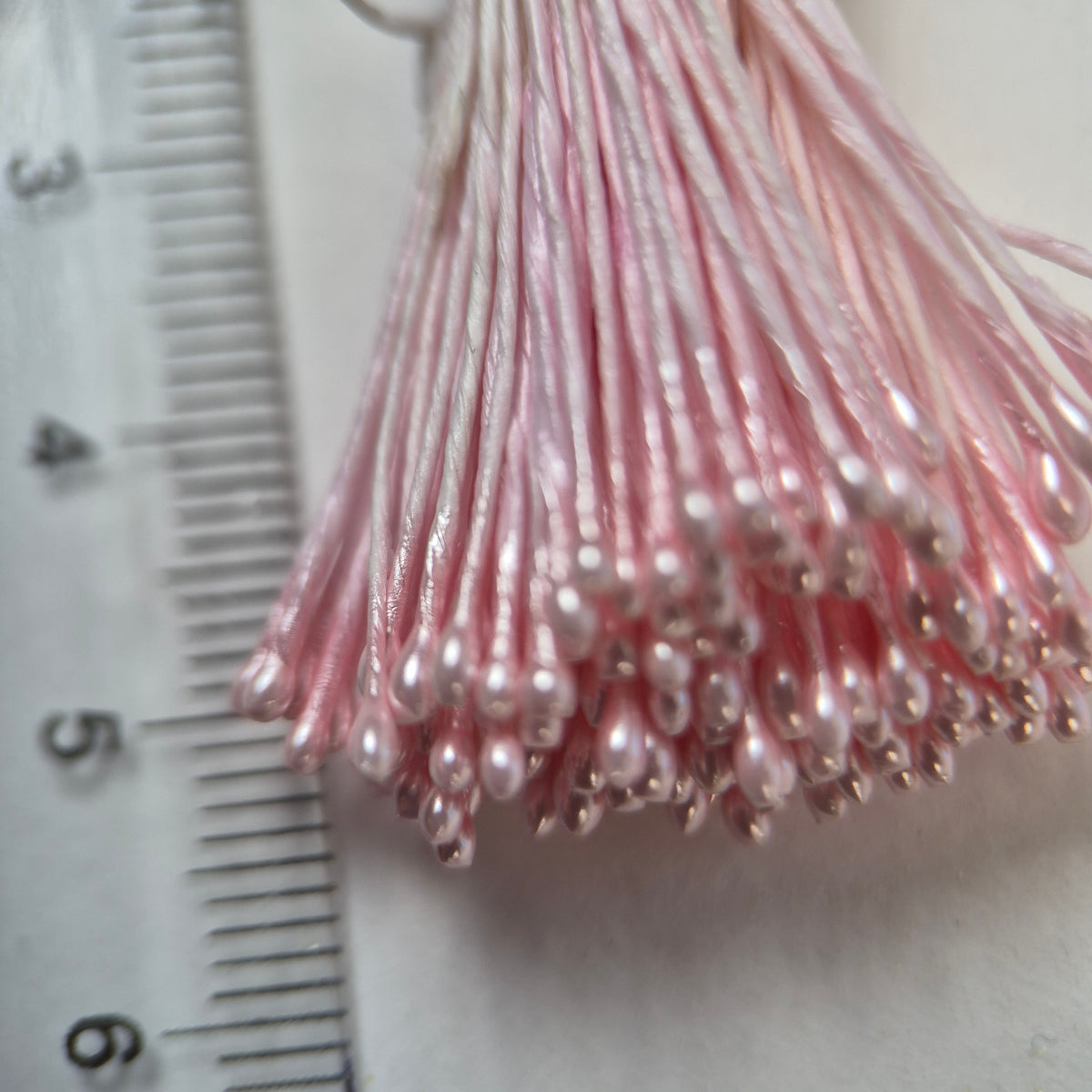 Pink pearly round ball flower stamens size M with glossy luster on matching pink cotton threads, premium Japanese craft supplies