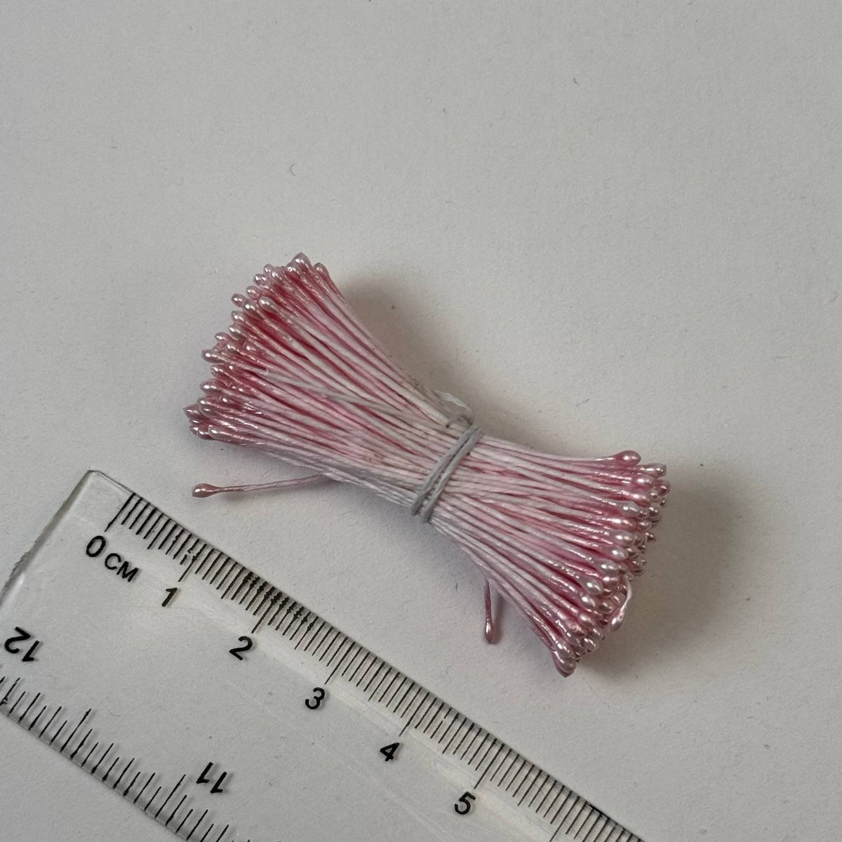 Pink pearly round ball flower stamens size M with glossy luster on matching pink cotton threads, premium Japanese craft supplies